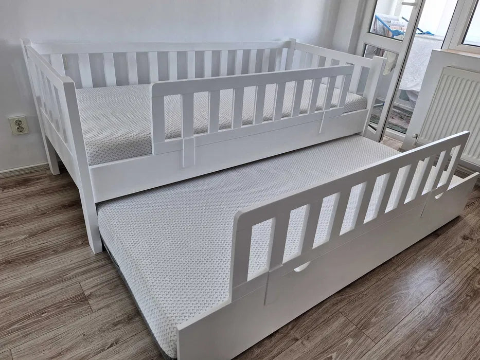 Pat single cu loc suplimentar din lemn masiv 122